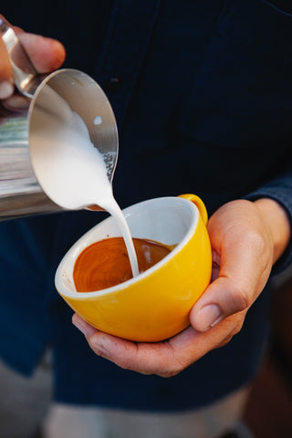 milk pouring from pitcher